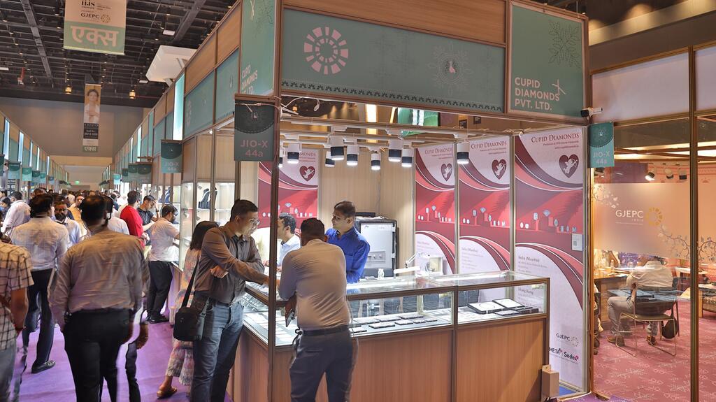Buyers crowd the aisles of the Diamond Pavilion at the IIJS show in India. The Indian market has come into focus as a potential future source of demand for natural diamonds in the face of slowing sales in other markets. IIJS show Diamond Pavilion